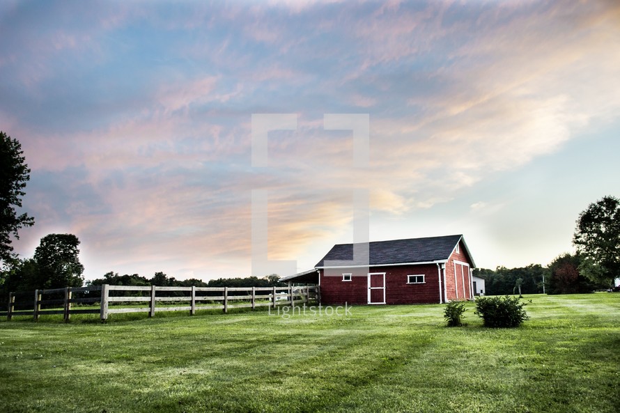 red barn and fence on a farm 