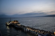 crowded pier at night 