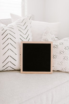 blank letter board on a couch 