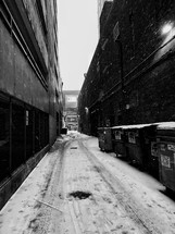 snow falling in an alley 