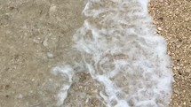 tide washing onto sands of a beach 