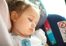 baby sleeping in baby car seat. Safety Concept