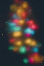Blurry Christmas lights and Christmas tree.