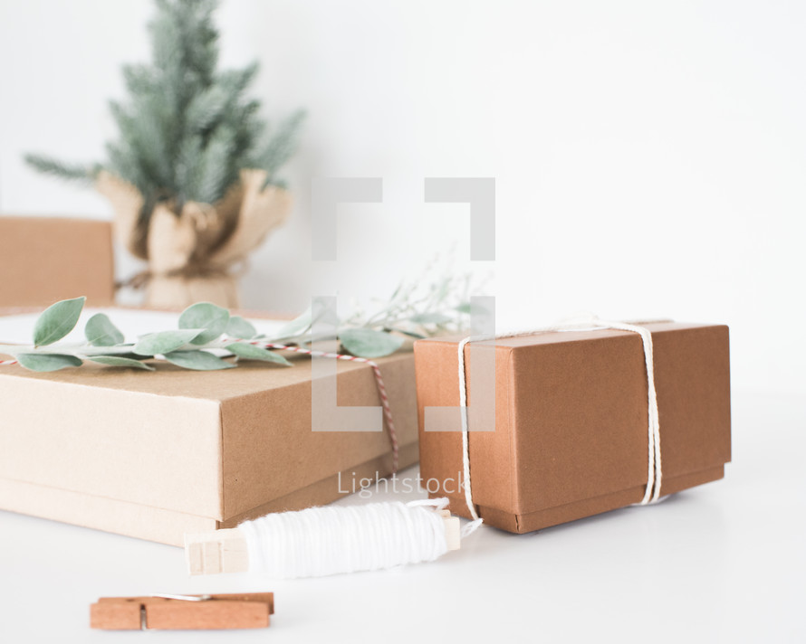 brown gift boxes for Christmas and a small Christmas tree 