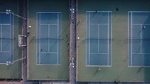 Payers on tennis courts