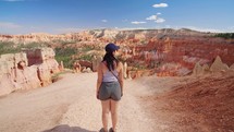 Female Hiker watching Beautiful view in Bryce Canyon National Park is a located in southwestern Utah in the United States
