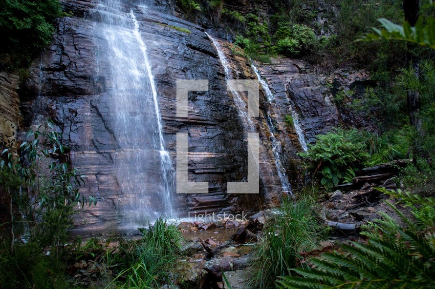 waterfall off a steep rocky cliff 