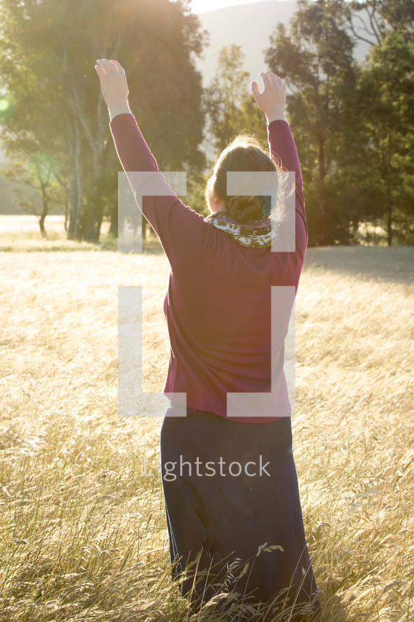 Woman Praising God in Field