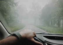 driving down a foggy rural road 
