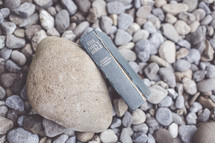 Bible on pebbles 