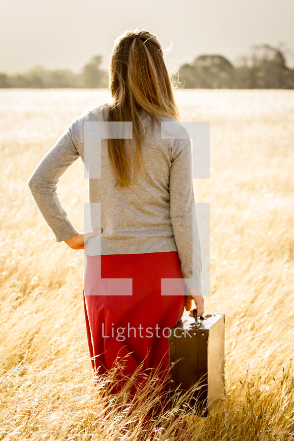 Girl holding Suitcase