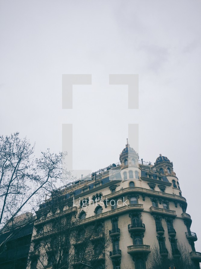 corner buildings in a foggy city 