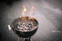 flames from a charcoal grill 