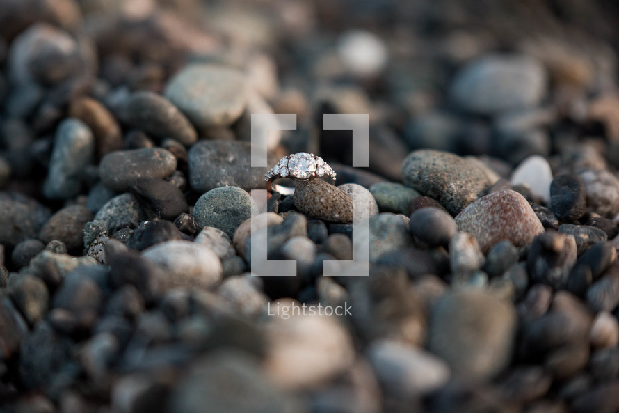 engagement ring on pebbles 