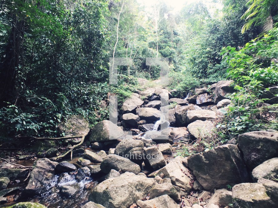 trickling water in a rock filled creek 