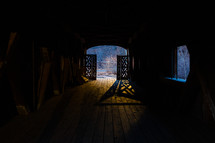 Light and shadows in covered bridge at night