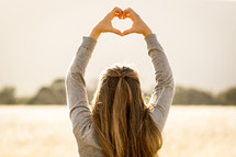 Girl Making Heart with Hands
