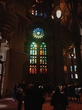 tourists viewing stained glass windows 