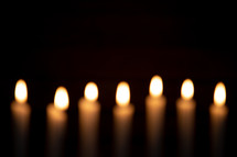 out of focus burning candles 