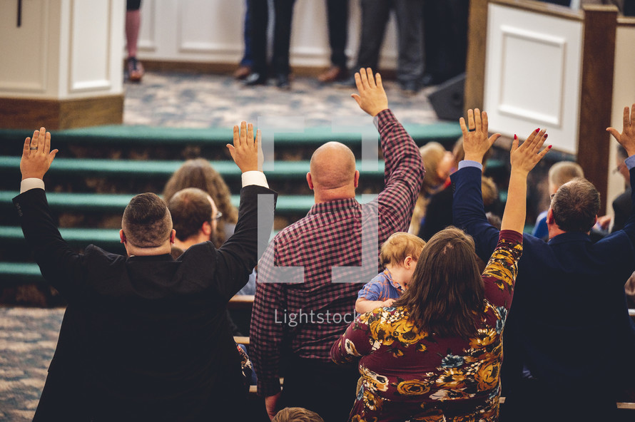 raised hands at Sunday Morning worship 