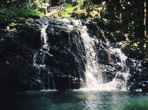 waterfall into a swimming hole 
