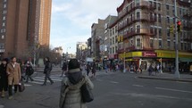 People crossing a crosswalk in China Town NYC