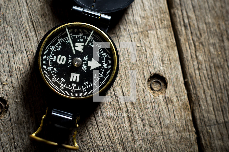 compass on wood background 