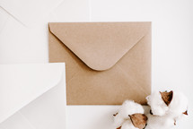 brown and white envelopes on white 