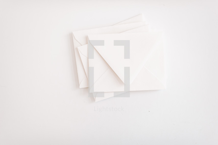 white envelopes on white 