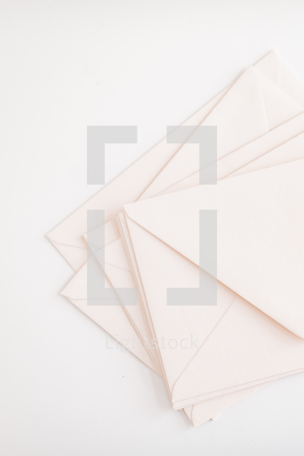 white envelopes on white 