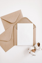 brown and white envelopes on white 
