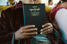 woman holding a Bible in Myanmar 