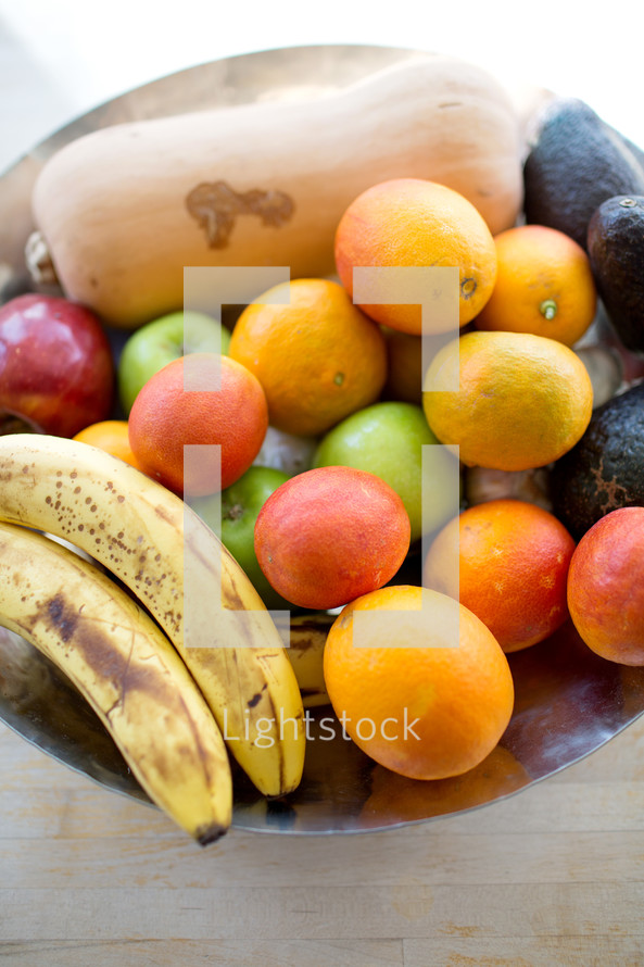 bowl of brightly colored fruit 