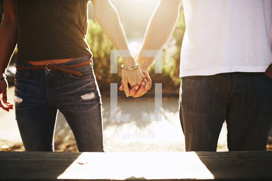 couple standing holding hands