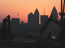 construction in a city at sunset 