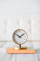 gold clock on white background 