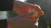 Hand Of Women Peeling Fresh Orange Fruit In Calabria