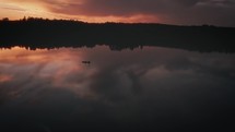 Boat On A Lake At Sunset