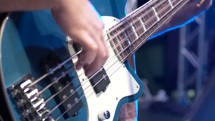 Beautiful shot of a bass guitar with natural light leaks coming in from the side.  Blue overtones, perfect editing clip for contemporary or youth service.  Shot in RAW on Cinema Camera at 2.5k.