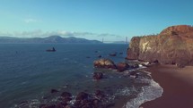 tide washing onto a shore | Crane Shot |  Coastline | Golden Gate Bridge | Coastline | Beach | Summer | San Francisco | Aerial | People | Waves | Nature | Landscape | Outside | California | West Coast | Mountains | Shore | Cliffs