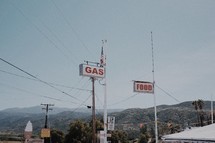 gas station and grocery store signs 