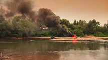 A fire on the coast of a river.
