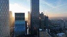 Bright Golden Sun Shining Through Buildings in London at Sunrise