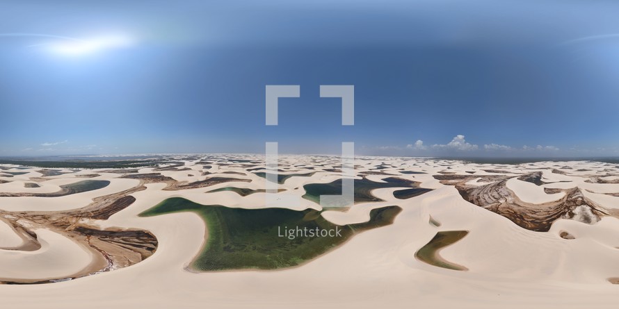 360 aerial photo taken with drone of many lakes in Lençóis Maranhenses National Park, full of sand dunes. Photo taken at midday with no clouds in Maranhão, Brazil