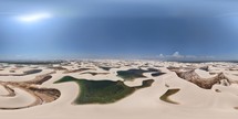 360 aerial photo taken with drone of many lakes in Lençóis Maranhenses National Park, full of sand dunes. Photo taken at midday with no clouds in Maranhão, Brazil