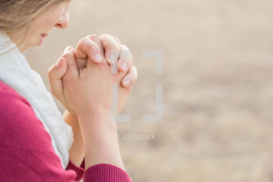 girl with praying hands 