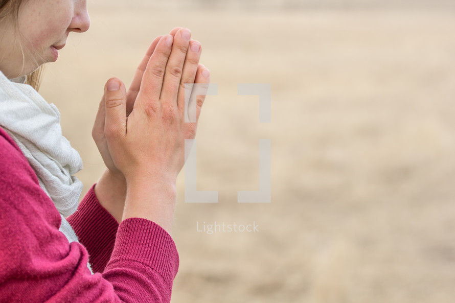 girl with praying hands 