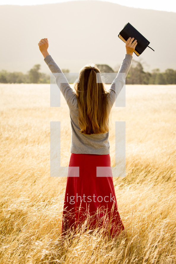 Girl Holding Arms up in Praise