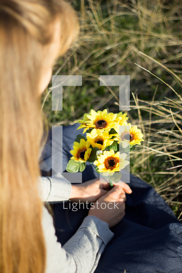 Girl holding Bouquet of Yellow Flowers