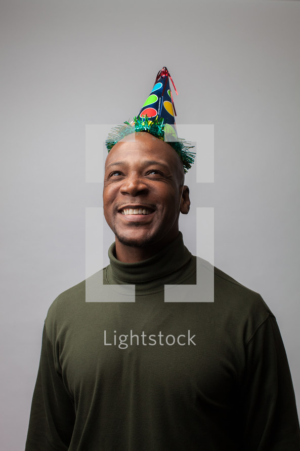 man wearing a party hat 